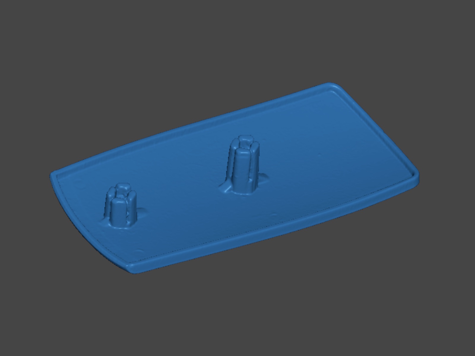 The raw scan mesh of the end cap shown in blue, with its two clip posts.