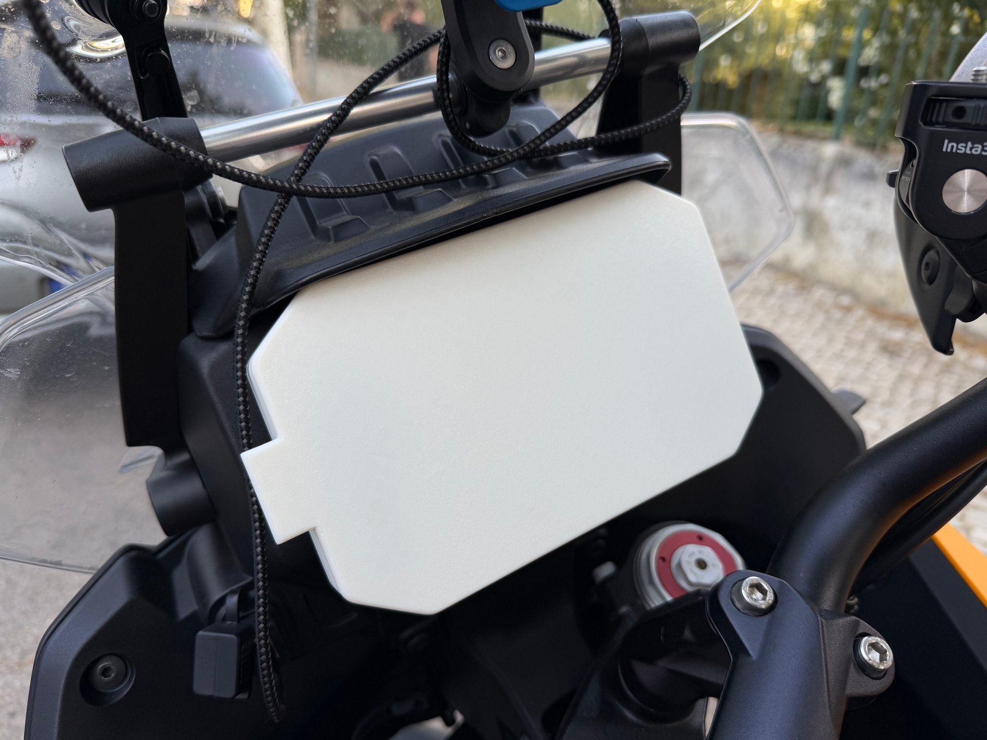 The finished dash cover seated over the instrument screen of the Moto Guzzi Stelvio.